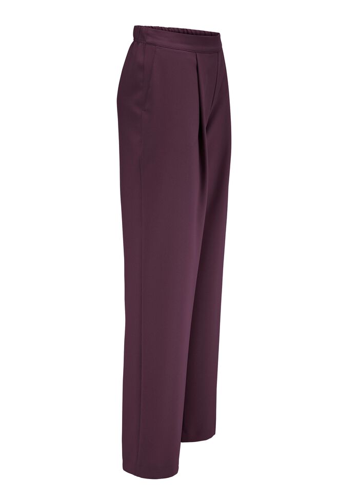 Byxor med veck i midjan i modern vidlek 