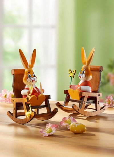 Kaniner i en gungstol 