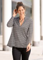 Skjorta i l&auml;tt utsv&auml;ngd form i 2 f&auml;rger 