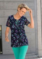 Skjorta med spetskant under 