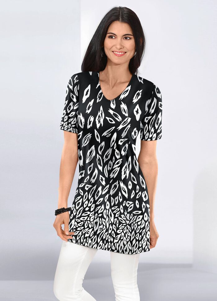 L&aring;ng skjorta i l&auml;tt utsv&auml;ngd form 