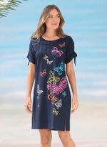 Kl&auml;nning med placerat tryck och rynkbara &auml;rmar 