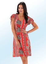 Kl&auml;nning med bl&auml;ckstr&aring;letryck och nedhasade &auml;rmar 