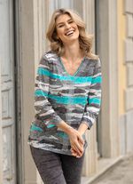 Skjorta med silverf&auml;rgade dekorativa tallrikar 