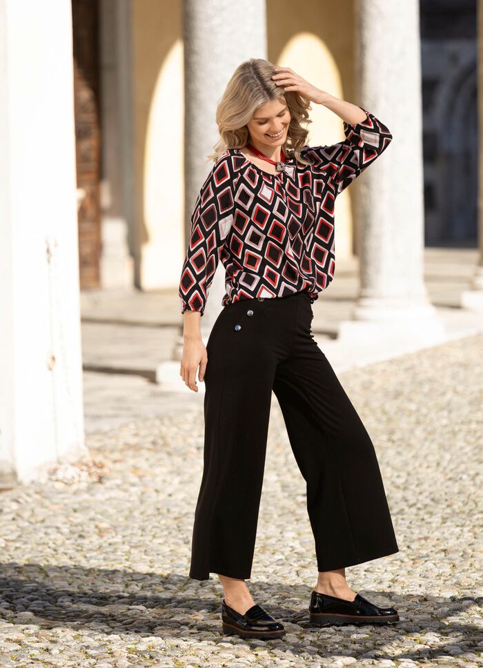 Tunika med f&auml;rgstarkt tryck 